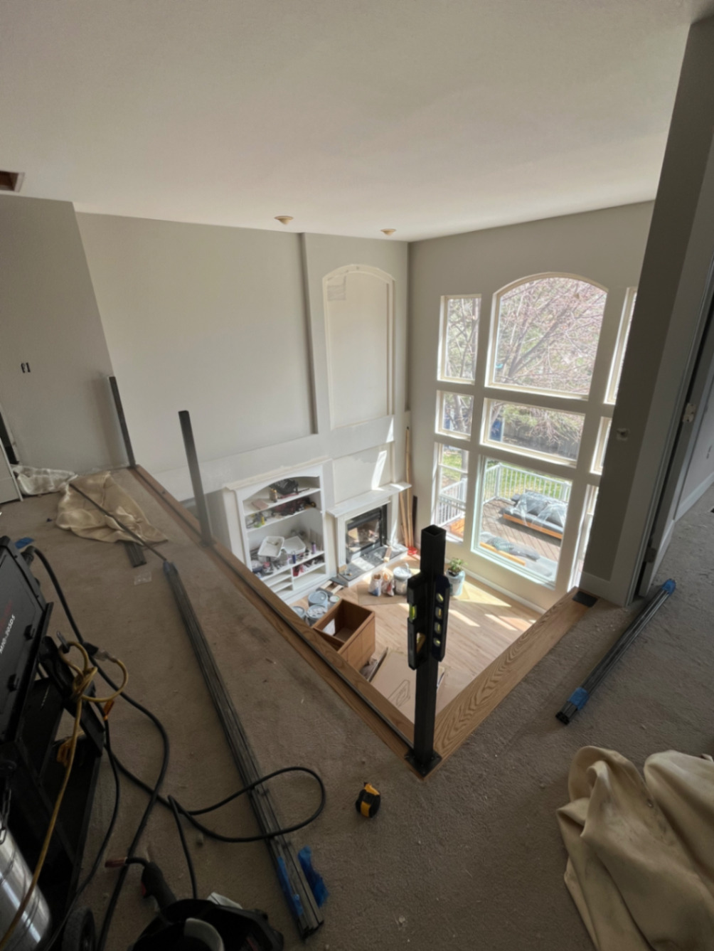 Loft opening prepped for custom horizontal-bar steel railing install