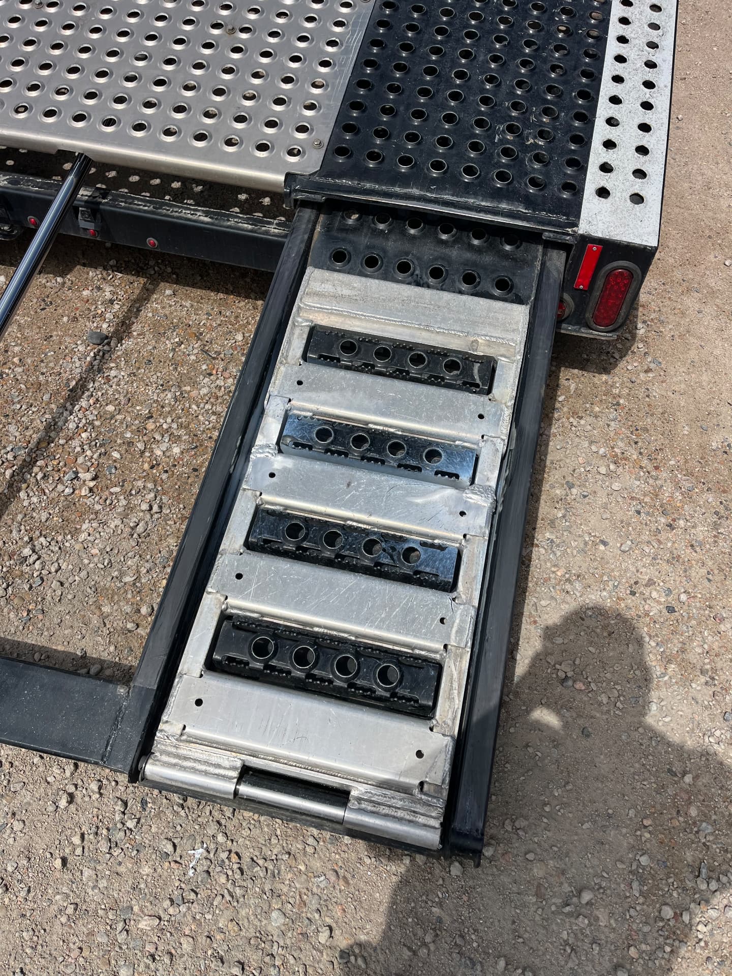 Aluminum trailer ramp repair with welded cross-members and traction strips
