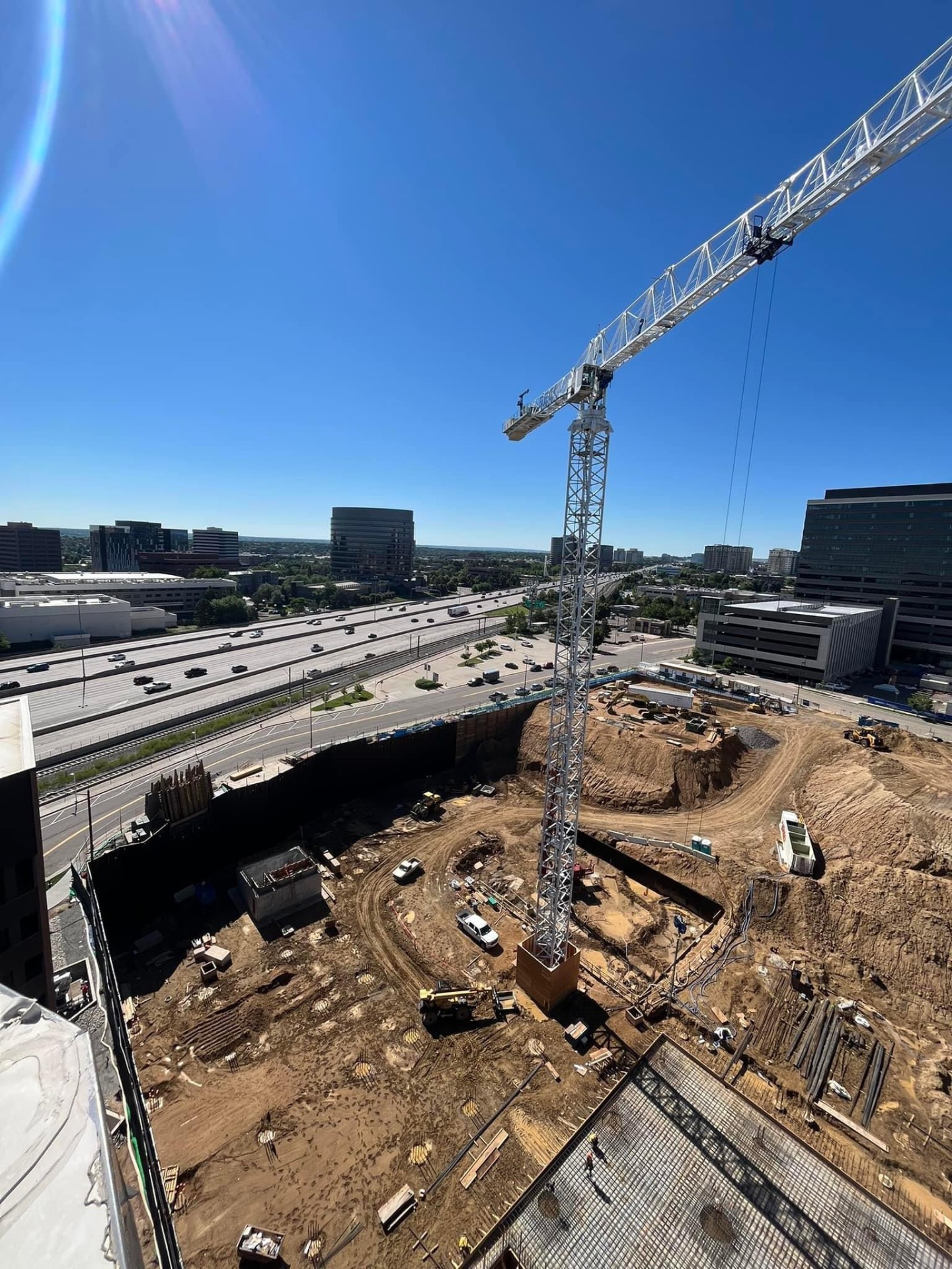 High-rise fabrication job site with tower crane in Denver Tech Center