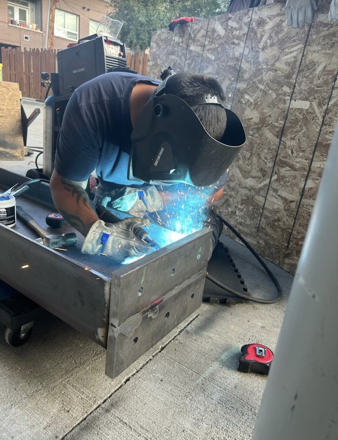 MIG welding steel plate in the shop