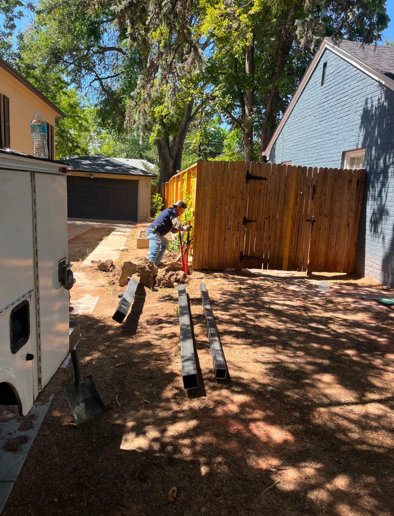 Setting steel gate posts for backyard driveway gate install