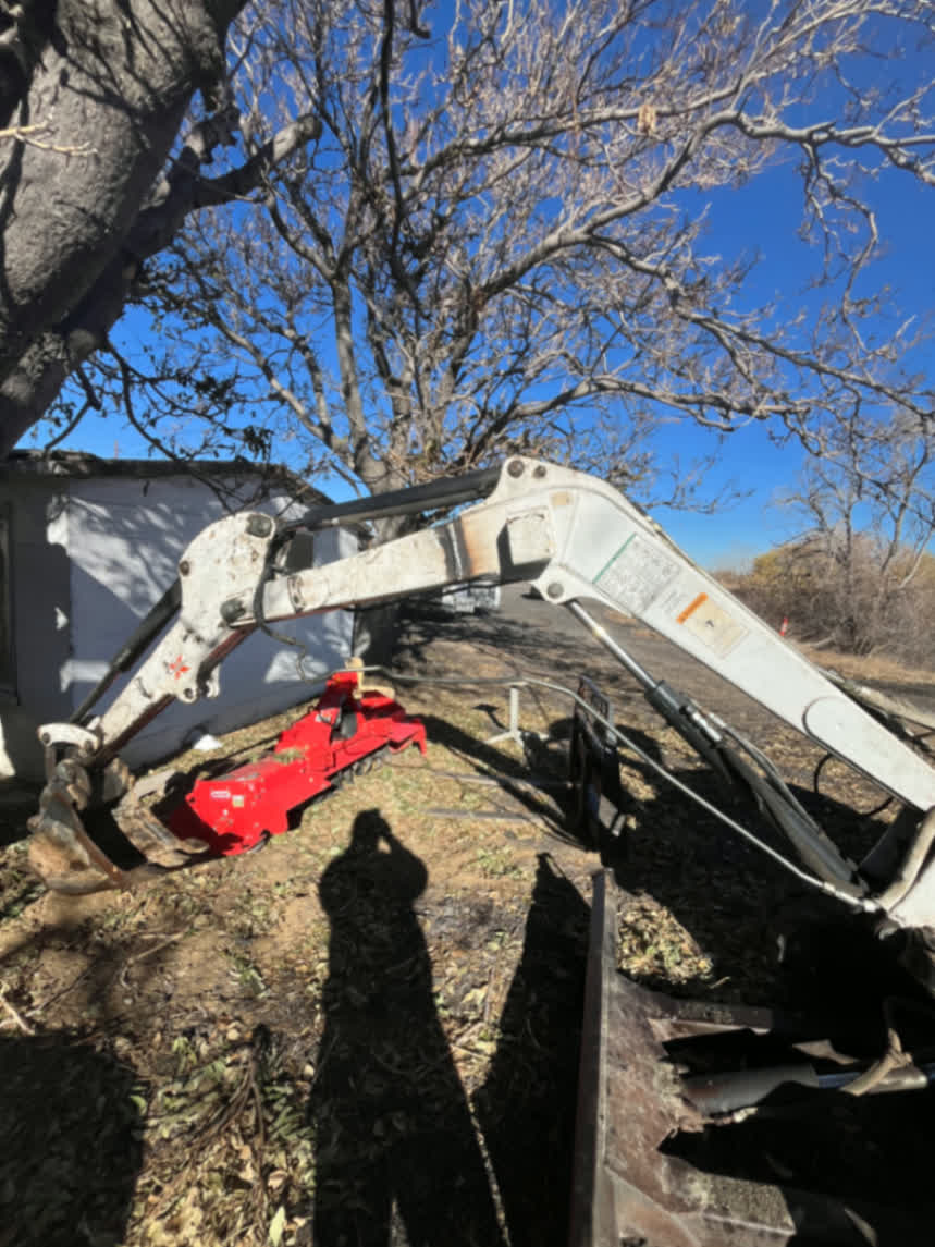 On-site backhoe arm repair in the field
