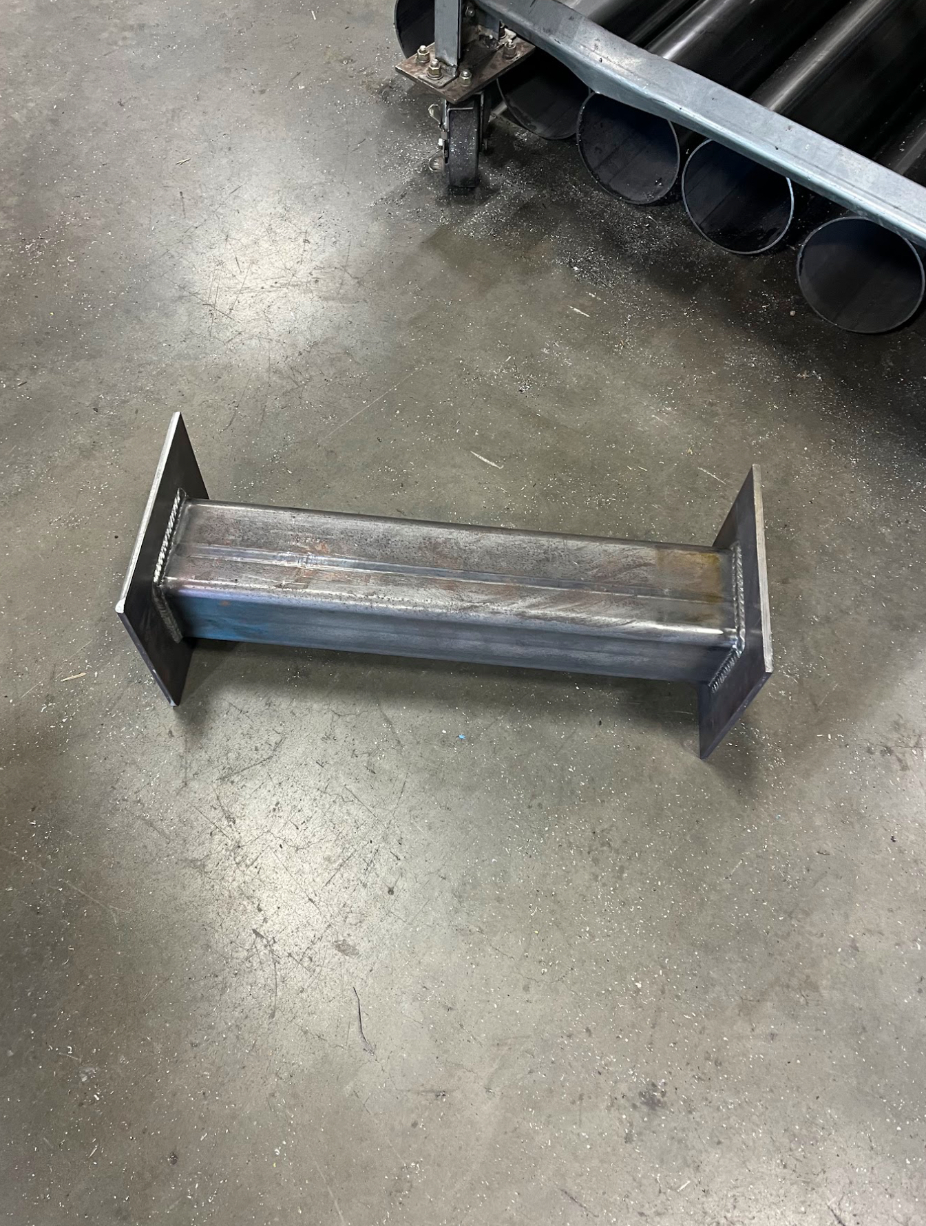 Custom welded structural steel I-beam section with base plates