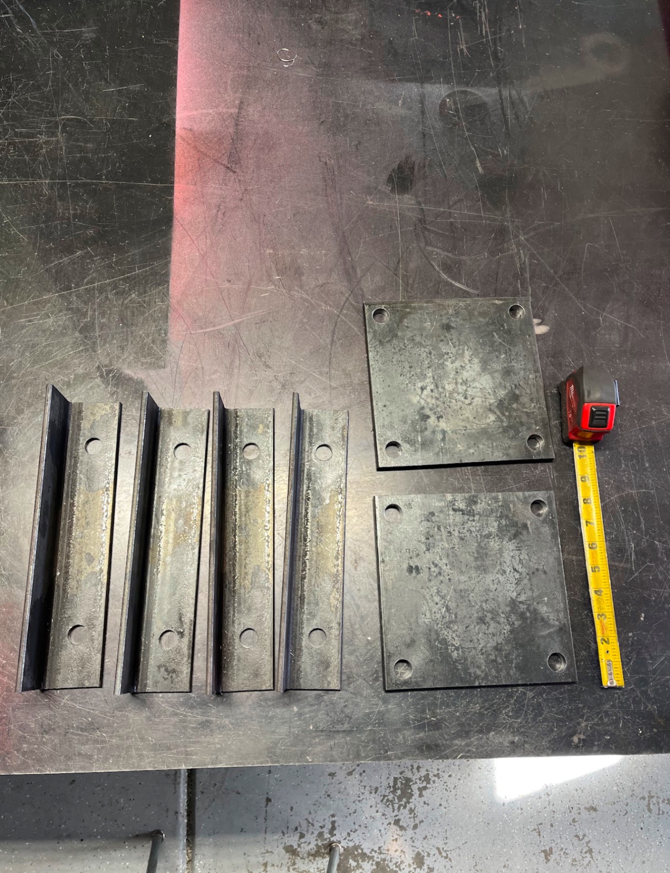 Fabricated steel stair stringer brackets and base plates ready for install