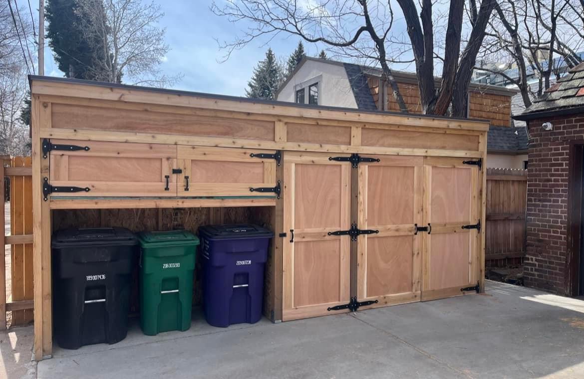Steel-hinged cedar trash and storage enclosure