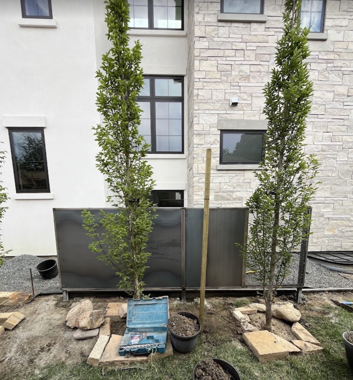 Modern steel privacy panel between homes