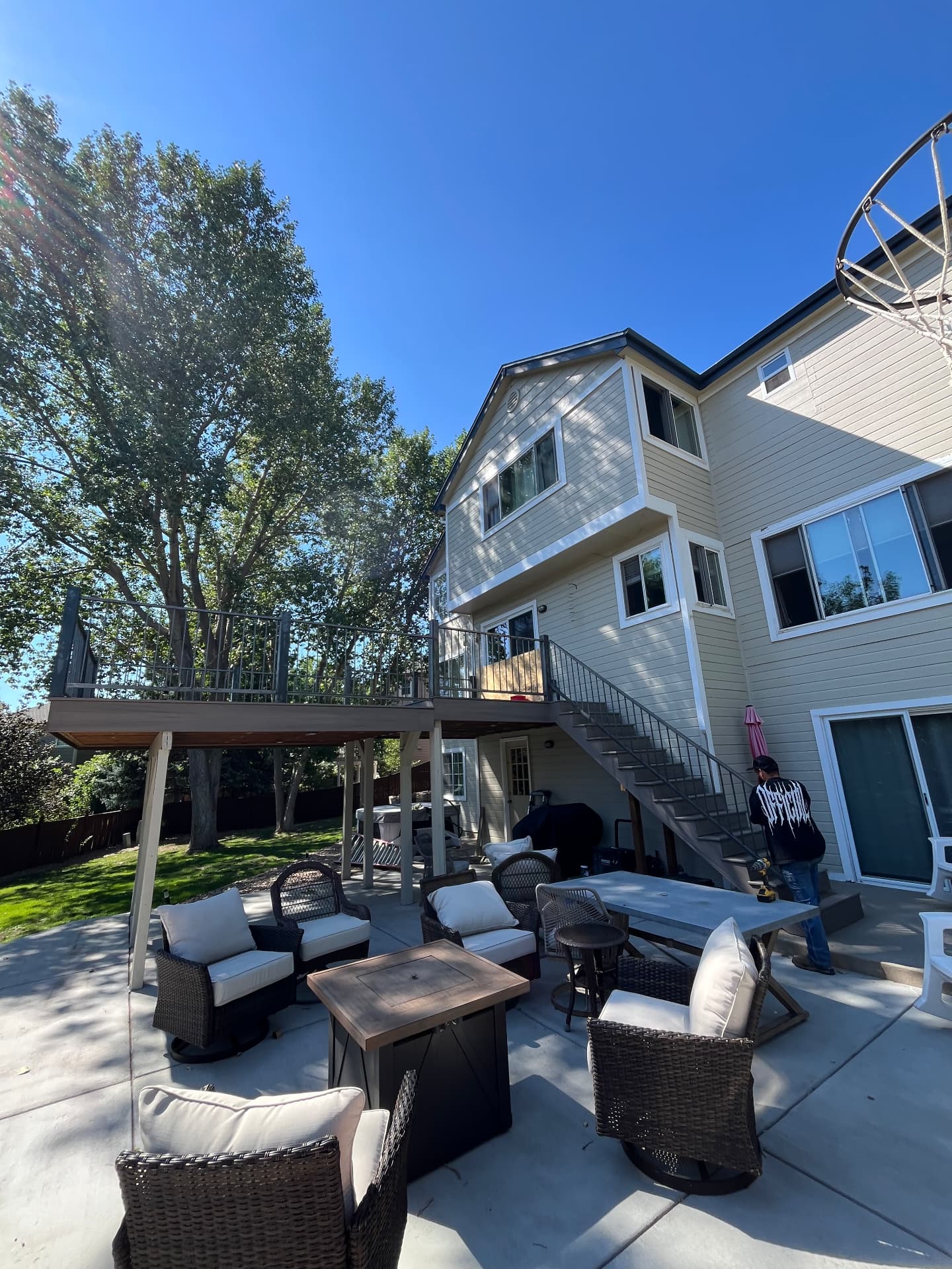 Elevated deck railing with steel stair handrail on Colorado home